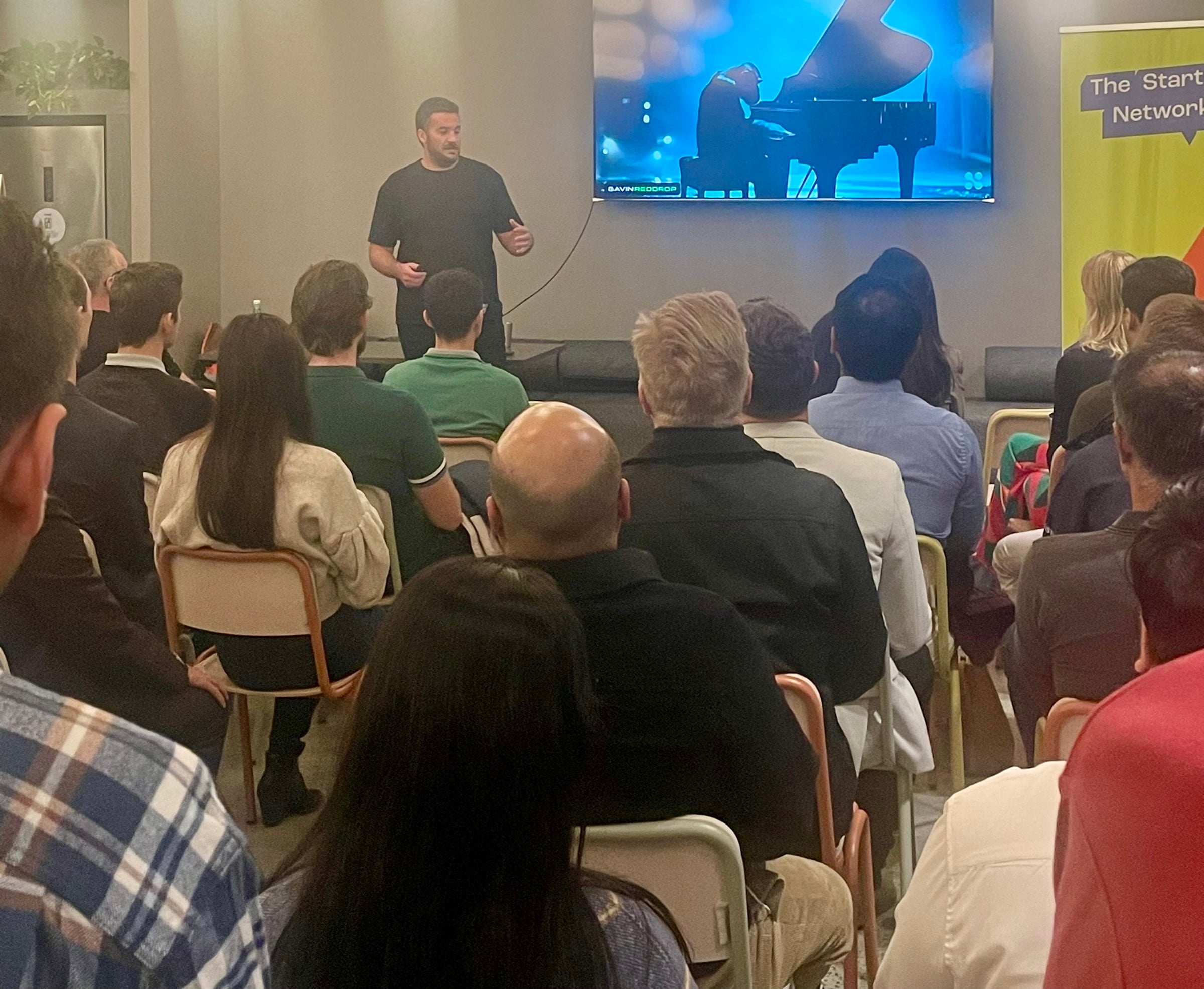 Gavin Reddrop presenting to a live audience
